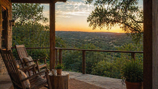 Hill Country sunset view from rustic porch with rocking chairs overlooking rolling Texas hills