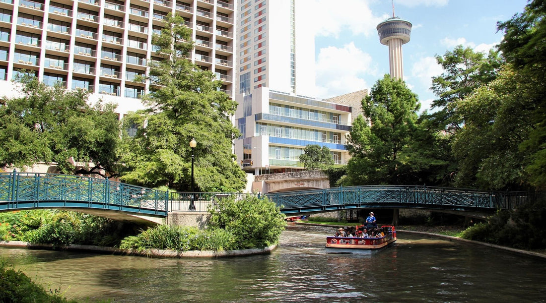 San Antonio River Walk with the Tower of the Americas in the background