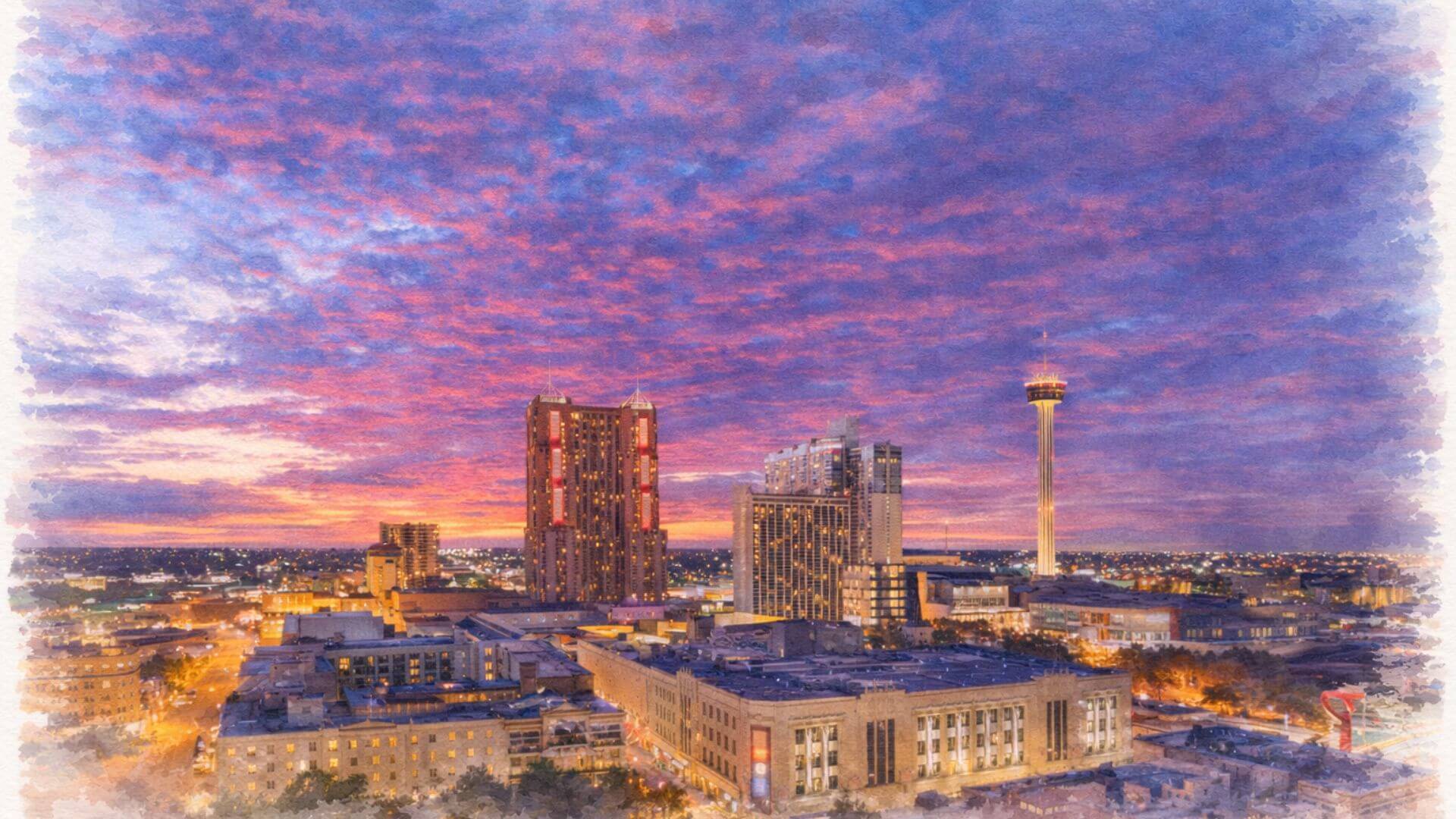 San Antonio, Texas skyline at sunset showing downtown and the Tower of the Americas.